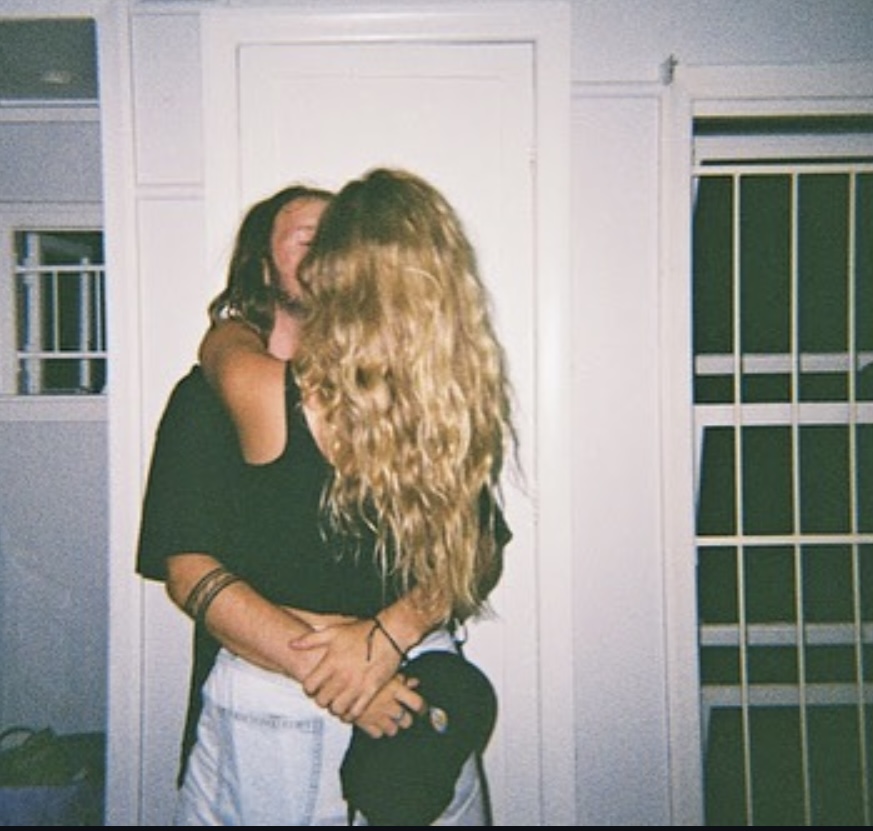 Natalie and Calvin embracing